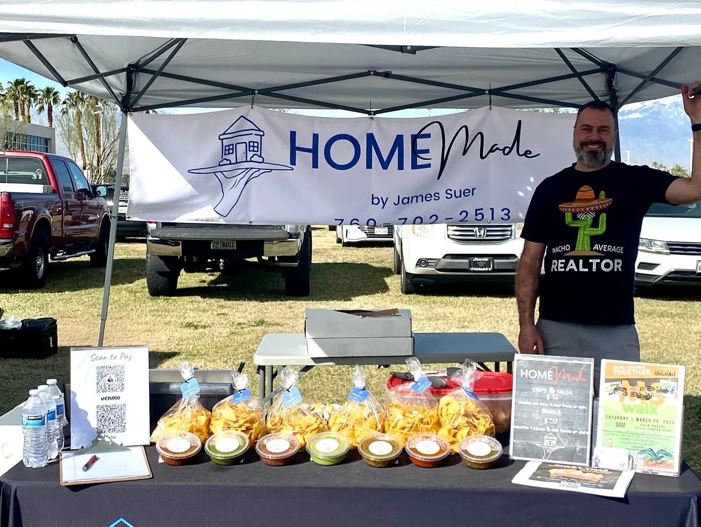 James at an early HOMEmade pop-up table in a Realtor t-shirt, with chips and salsa cups lined up