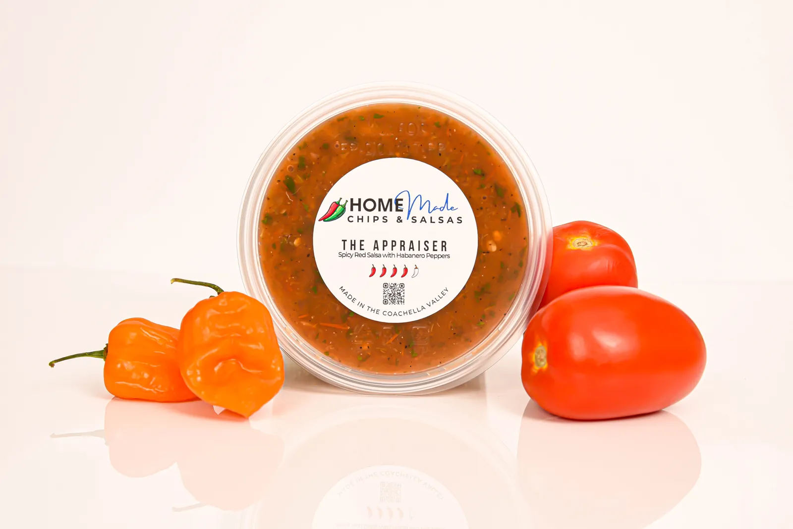 A tub of The Appraiser salsa with its fresh ingredients