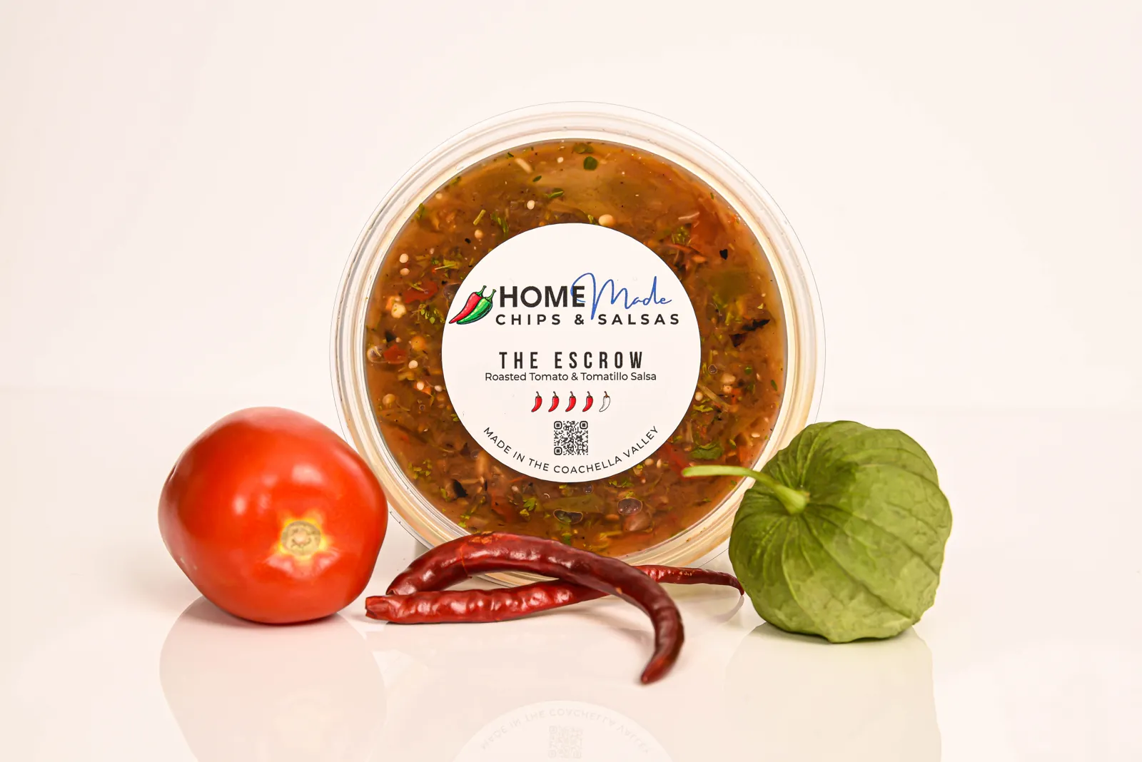 A tub of The Escrow salsa with its fresh ingredients
