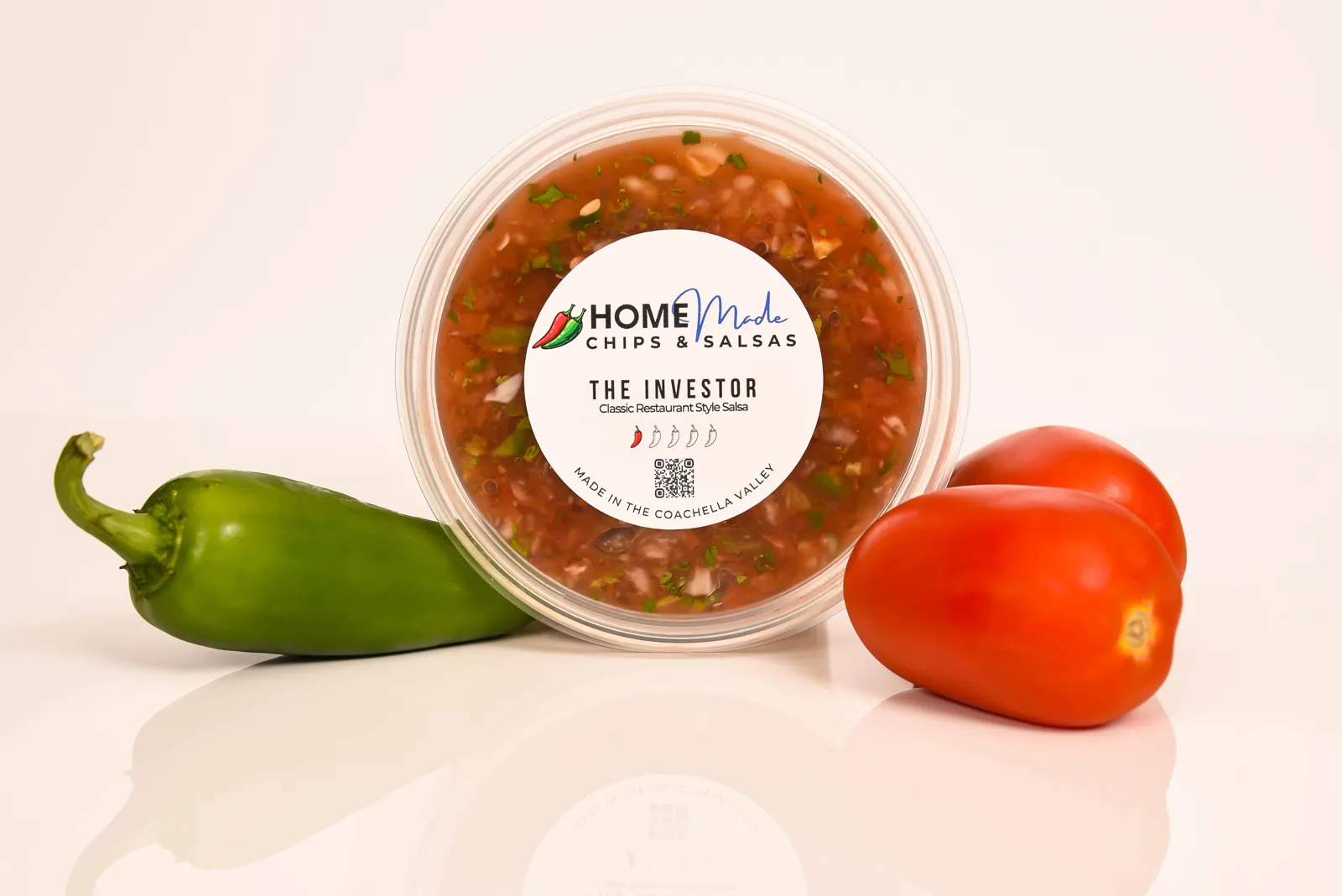 A tub of The Investor salsa with its fresh ingredients